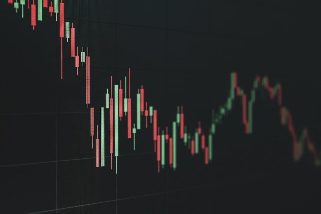 Stock market chart shows a declining trend.
