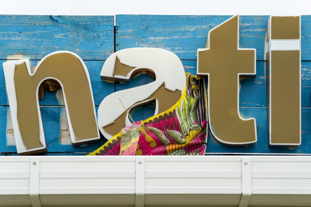 A wooden sign that says transit on it