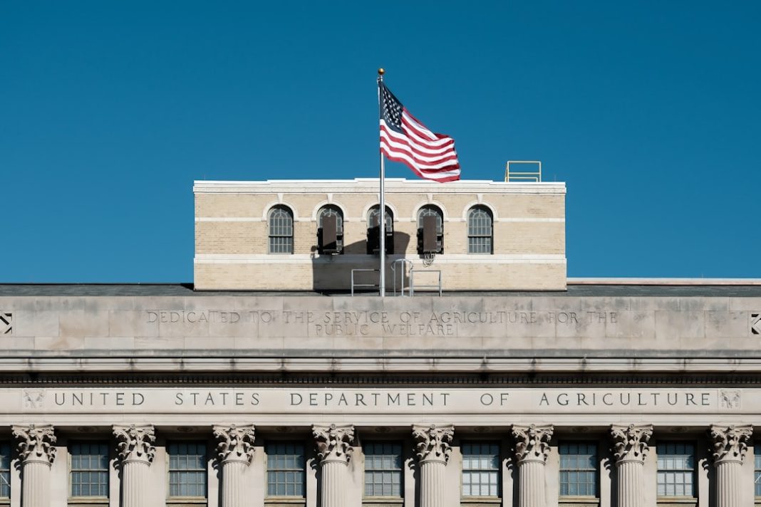 American flag flies over united states department of agriculture building.